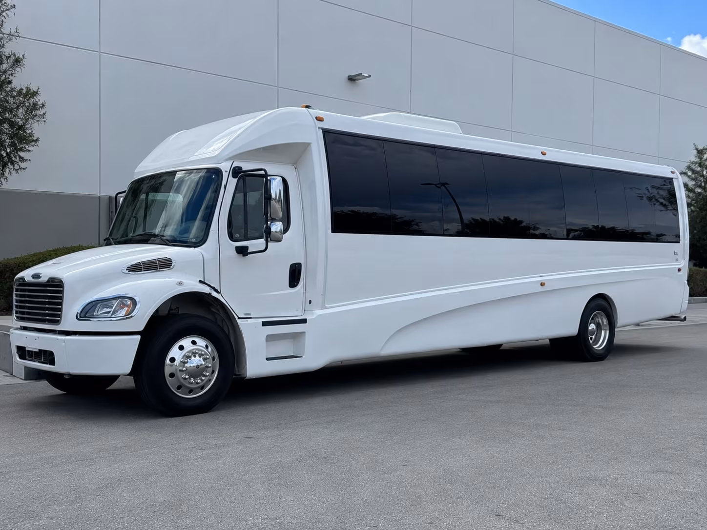 Wedding guests seated inside a party bus serving Clovis